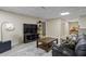 Finished basement with seating, television, and storage, providing flexible space for relaxation and entertainment at 134 Waterloch Ct, Lawrenceville, GA 30043