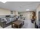 Finished basement offering a comfortable seating area, exercise equipment, and ample space for activities at 134 Waterloch Ct, Lawrenceville, GA 30043