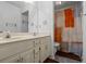 Bathroom with double sinks, large mirror, and shower/tub combo at 134 Waterloch Ct, Lawrenceville, GA 30043
