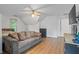 Spacious carpeted bedroom with ceiling fan, TV, and natural light at 134 Waterloch Ct, Lawrenceville, GA 30043