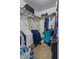 Walk-in closet with tile floor, shelving and rods for ample storage at 134 Waterloch Ct, Lawrenceville, GA 30043