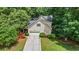 Exterior elevation of home featuring two-car garage, driveway, and manicured lawn at 134 Waterloch Ct, Lawrenceville, GA 30043