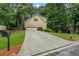 A charming two-story home with a well-manicured lawn and extended driveway at 134 Waterloch Ct, Lawrenceville, GA 30043