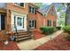 Charming brick home showcasing a well-maintained front yard and inviting entrance with landscaped walkway at 134 Waterloch Ct, Lawrenceville, GA 30043