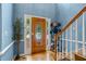 Inviting foyer with wood floors, a decorative door, and a view of the staircase at 134 Waterloch Ct, Lawrenceville, GA 30043
