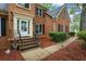 Brick home featuring a welcoming front entrance with brick steps and iron railings at 134 Waterloch Ct, Lawrenceville, GA 30043