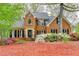 Charming brick home with a manicured lawn, beautiful landscaping, and a welcoming entrance at 134 Waterloch Ct, Lawrenceville, GA 30043