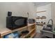 Kitchenette area featuring a sink, microwave, toaster oven and shelving at 134 Waterloch Ct, Lawrenceville, GA 30043