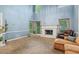 Spacious living room featuring a cozy fireplace and tall windows at 134 Waterloch Ct, Lawrenceville, GA 30043