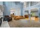 Open-concept living room with a fireplace and seamless flow to the kitchen and dining area at 134 Waterloch Ct, Lawrenceville, GA 30043