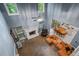 Living room with fireplace, multiple windows, ceiling fan, and an eating area at 134 Waterloch Ct, Lawrenceville, GA 30043