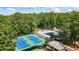 Community amenities including pool and tennis courts surrounded by mature trees at 134 Waterloch Ct, Lawrenceville, GA 30043