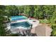 Aerial view of neighborhood pool, tennis courts and playground at 134 Waterloch Ct, Lawrenceville, GA 30043