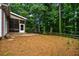 Backyard with a screened porch and a stone patio at 1772 Benningfield Sw Dr, Marietta, GA 30064