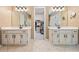 Dual sinks, white cabinets, and tile flooring highlight the design in this bathroom at 1772 Benningfield Sw Dr, Marietta, GA 30064
