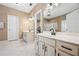 Well-lit bathroom featuring double sinks, neutral cabinets, and a walk-in shower at 1772 Benningfield Sw Dr, Marietta, GA 30064