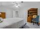 Bright bedroom with hardwood furniture, a ceiling fan, and a comfortable bed with neutral bedding at 1772 Benningfield Sw Dr, Marietta, GA 30064
