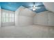 Spacious bedroom with painted blue sky ceiling, carpeting and a window with shutters at 1772 Benningfield Sw Dr, Marietta, GA 30064