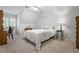 Cozy bedroom featuring a neutral palette, plush carpeting, and a comfortable bed with decorative pillows at 1772 Benningfield Sw Dr, Marietta, GA 30064