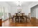 Formal dining room with hardwood floors, a chandelier, and plantation shutters at 1772 Benningfield Sw Dr, Marietta, GA 30064