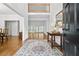 Elegant foyer with hardwood floors, a statement rug, and a view of the second floor at 1772 Benningfield Sw Dr, Marietta, GA 30064