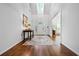 Bright foyer featuring hardwood floors, white walls, and a decorative rug at 1772 Benningfield Sw Dr, Marietta, GA 30064