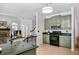 Open-concept kitchen seamlessly connected to the living room, showcasing modern appliances and a functional layout at 1772 Benningfield Sw Dr, Marietta, GA 30064
