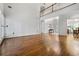 Large living room featuring hardwood floors, tall ceilings, and a view of the entryway at 1772 Benningfield Sw Dr, Marietta, GA 30064