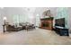 Bright living room featuring a fireplace, large windows with shutters, and comfortable seating arrangements at 1772 Benningfield Sw Dr, Marietta, GA 30064