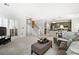 Spacious living room with staircase, shutters, open floor plan, and seamless connection to the kitchen at 1772 Benningfield Sw Dr, Marietta, GA 30064