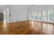 Spacious living room with hardwood floors, plenty of natural light, and a view of the backyard at 1772 Benningfield Sw Dr, Marietta, GA 30064