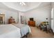 Spacious bedroom with neutral carpet, a dresser and a chair with accent pillows at 1772 Benningfield Sw Dr, Marietta, GA 30064