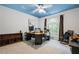 Home office with built in desk and shelving and a blue sky painted on the ceiling at 1772 Benningfield Sw Dr, Marietta, GA 30064