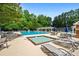 Resort-style pool area with lounge chairs, umbrellas, and a shallow pool at 1772 Benningfield Sw Dr, Marietta, GA 30064