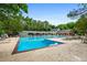 Large community swimming pool with ample seating, shade structures, and well-maintained surroundings at 1772 Benningfield Sw Dr, Marietta, GA 30064