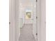 Bathroom entrance with tile floors and a door with recessed panels at 1940 Van Allen Ct, Dacula, GA 30019
