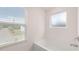 Bright bathroom with a tub and window views at 1940 Van Allen Ct, Dacula, GA 30019