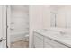 Bathroom featuring a double sink vanity with white cabinets and a shower-tub combo at 1940 Van Allen Ct, Dacula, GA 30019