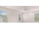 Bright bedroom with multiple windows and a ceiling fan at 1940 Van Allen Ct, Dacula, GA 30019