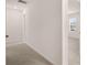 Hallway leading to bedroom with a view of neighborhood through the window at 1940 Van Allen Ct, Dacula, GA 30019