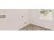 The laundry room has tile floors, hookups for a washer and dryer, and a window at 1940 Van Allen Ct, Dacula, GA 30019