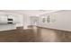 Open concept living area connected to the kitchen with lots of natural light at 1940 Van Allen Ct, Dacula, GA 30019