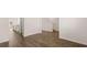 Open concept living space with wood floors and stairs leading to the upper level at 1940 Van Allen Ct, Dacula, GA 30019