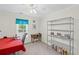 Bedroom featuring a metal storage shelf, desk, and large window at 2261 Seatton Ct, Marietta, GA 30062