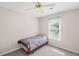 Cozy bedroom with a comfortable bed, bright window, and carpet flooring at 2261 Seatton Ct, Marietta, GA 30062