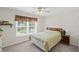 Bedroom with neutral walls, carpet, and large window with blinds at 2261 Seatton Ct, Marietta, GA 30062