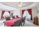 Bright dining room with large table, red cloth, and view into an adjacent living room at 2261 Seatton Ct, Marietta, GA 30062