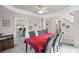 Formal dining room with large table, six chairs, crown moulding, and adjacent living spaces at 2261 Seatton Ct, Marietta, GA 30062