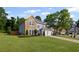 Beautifully landscaped home with lush green lawn, attached garage, and mature shade trees at 2261 Seatton Ct, Marietta, GA 30062