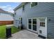 Rear exterior featuring a patio area, grill, and door to the backyard at 2261 Seatton Ct, Marietta, GA 30062